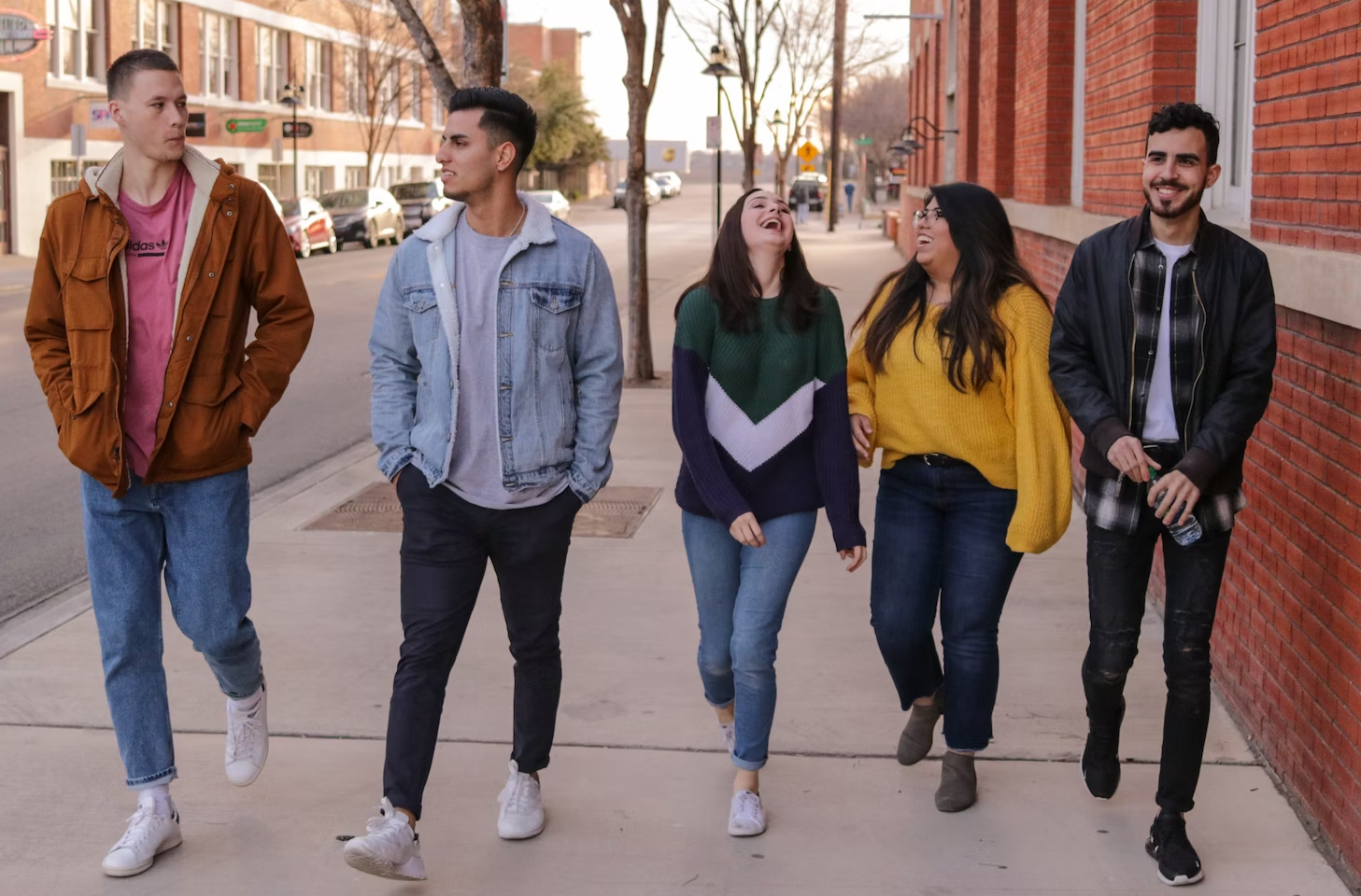 5 young people walking together