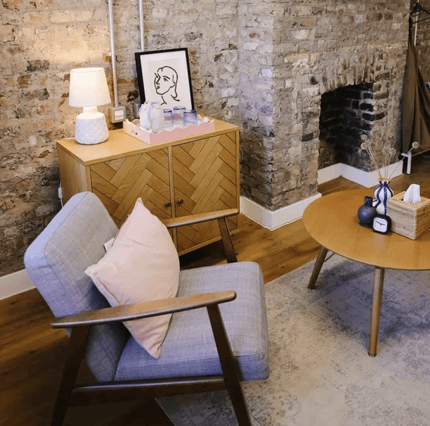 Psychology therapy room with grey chair